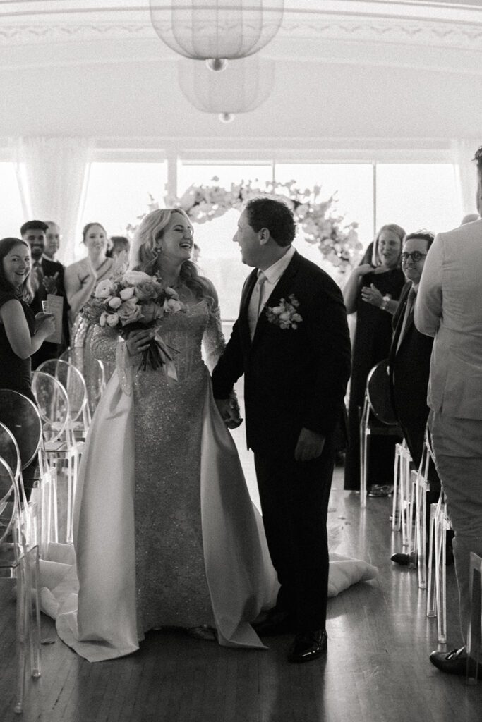 Bride and groom walking down the aisle during their wedding at the Cottonwood