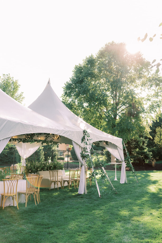 white sailcloth tent with florals engagement party Omaha