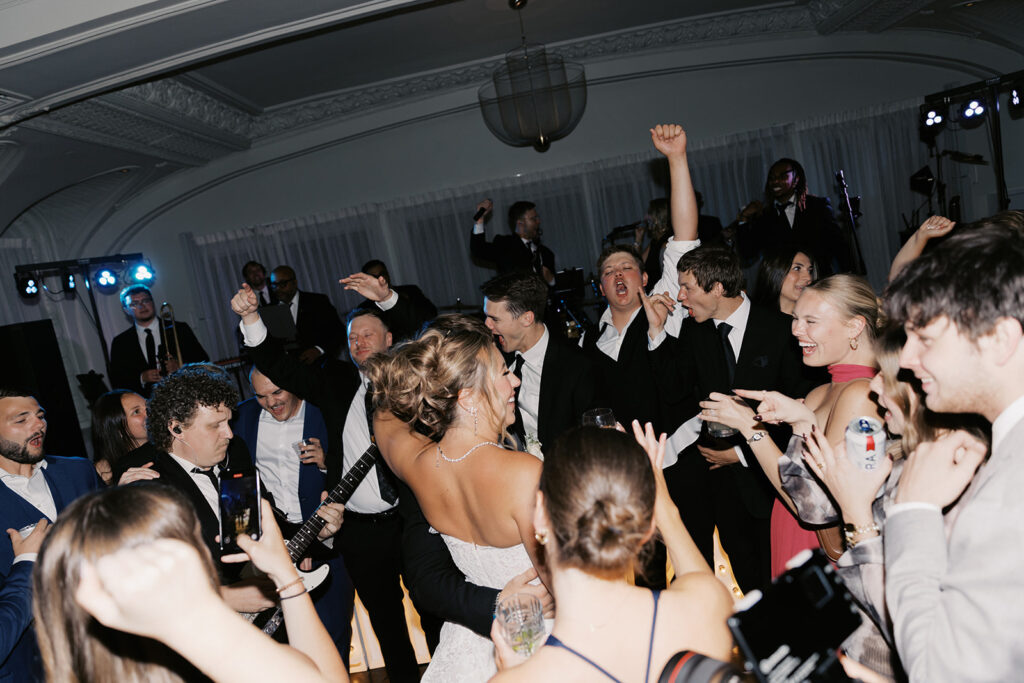 Guests dancing to The Downtown Collective live band at a Kimpton Cottonwood wedding reception